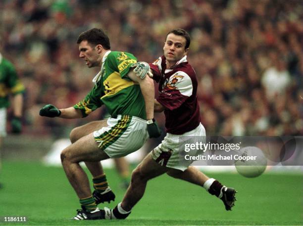 Derek Savage of Galway in action with Michael McCarthy of Kerry during the All-Ireland GAA Final at Croke Park, Dublin, Ireland. Mandatory Credit:...