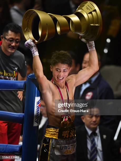 Naoya Inoue of Japan celebrates his victory by lifting the Muhammad Ali Trophy after the WBSS Bantamweight Final at Saitama Super Arena on November...