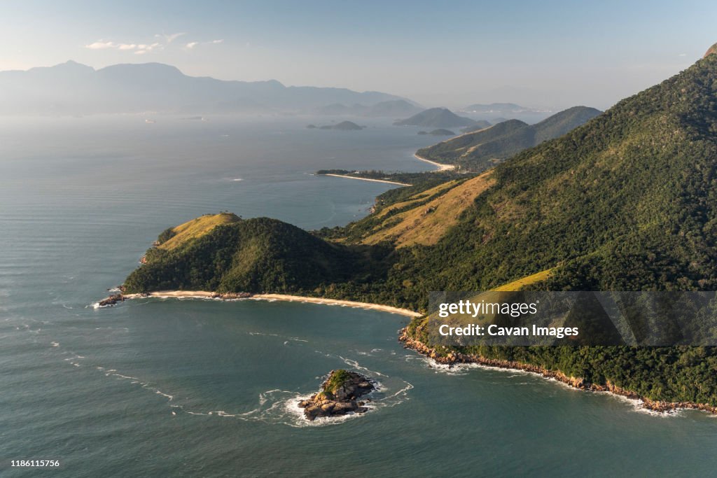 Aerial view from helicopter flight to beautiful beach and rainforest