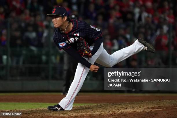 Pitcher Yoshinobu Yamamoto of Japan throws in the bottom of 9th inning during the WBSC Premier 12 Opening Round Group B game between Chinese Taipei...