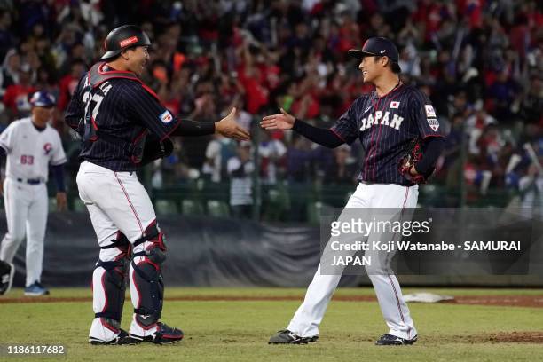 Pitcher Yoshinobu Yamamoto of Japan celebrates with Catcher Tsubasa Aizawa after the bottom of 9th inning during the WBSC Premier 12 Opening Round...