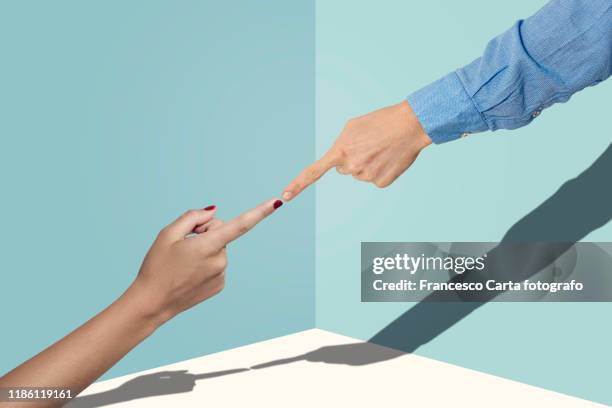 finger pointing - contact color background stock-fotos und bilder