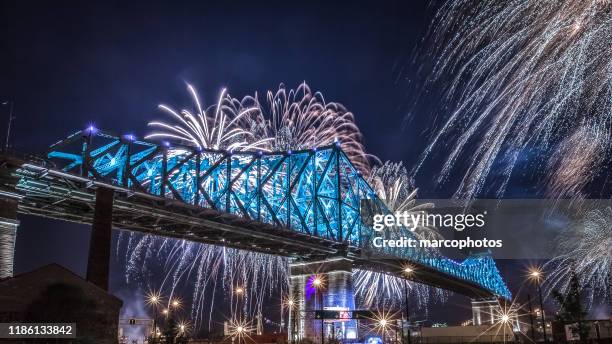 the illuminated jacques cartier bridge. - québec stock pictures, royalty-free photos & images