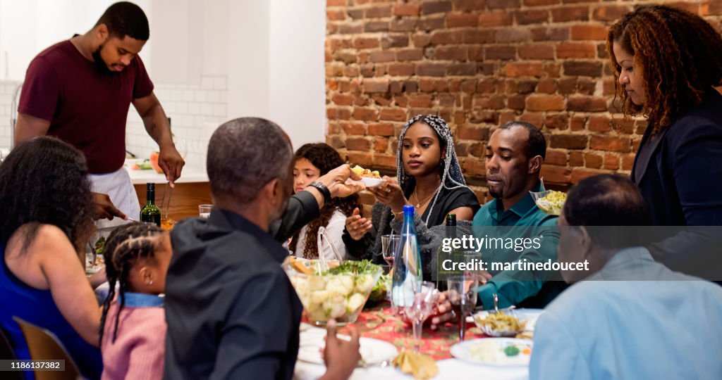 Multi-generation family enjoying Thanksgiving dinner.