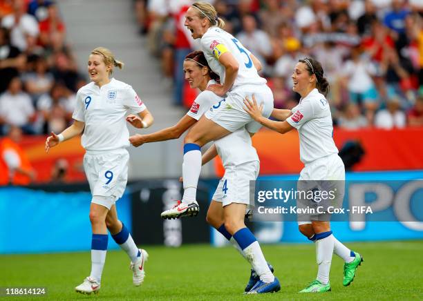 Jill Scott of England celebrates with Faye White and Fara Williams after Scott's goal against France during the FIFA Women's World Cup 2011 Quarter...