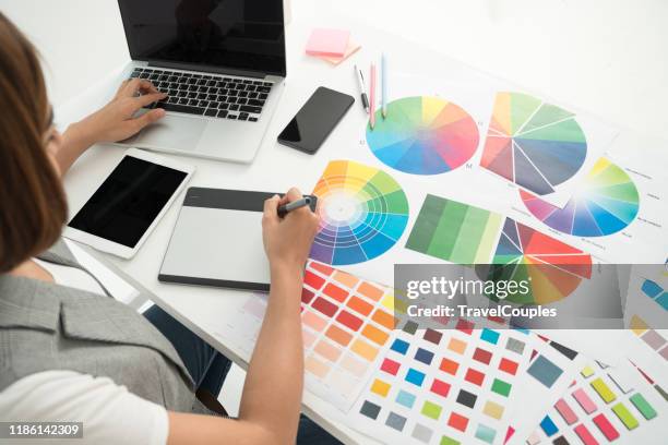 graphic designer at work. color swatch samples. artist drawing something on graphic tablet at the office. graphic designer creativity editor ideas designer concept - graphic designer bildbanksfoton och bilder