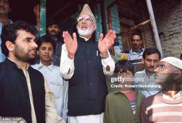 Kashmiri separatist and a leader of the Jamaat-e-Islami group Syed Ali Shah Geelani speaks to a crowd of anti-election sympathizers, on the outskirts...