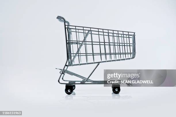 wire frame trolley - shopping cart stock pictures, royalty-free photos & images