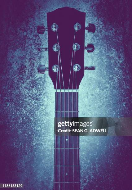 textured guitar neck - acoustic guitar foto e immagini stock