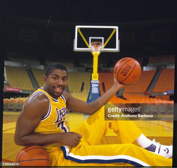 Portrait of basketball great Earvin "Magic" Johnson Jr., point guard for the Los Angeles Lakers of the National Basketball Association, dressed in...