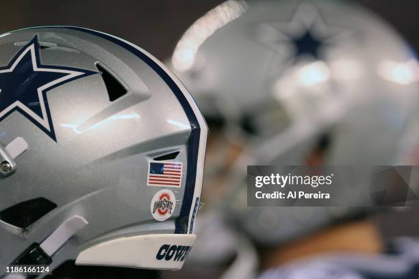 Detail view of a College Football logo sticker on the helmet of the Dallas Cowboys in the game against the New York Giants in the first half at...