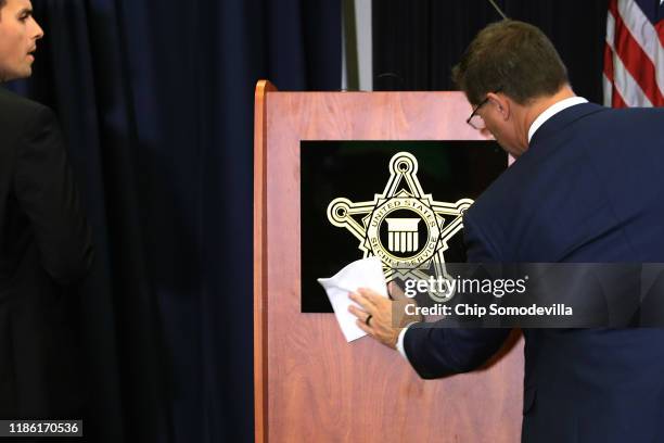 Sign with the U.S. Secret Service shield is cleaned before a briefing about the newly released analysis of targeted school violence at the service's...