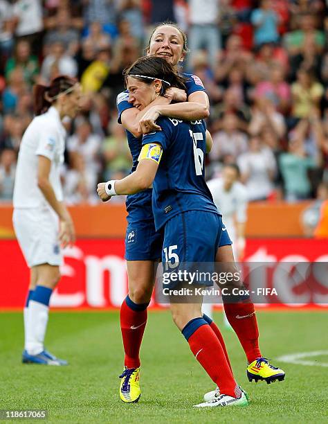 Elise Bussaglia of France celebrates with Gaetane Thiney after Bussaglia scored the equalizer against England during the FIFA Women's World Cup 2011...