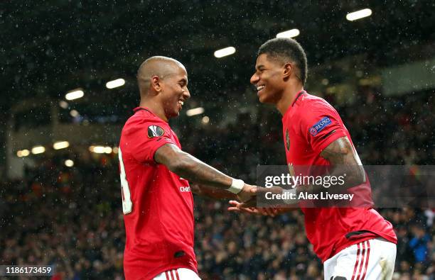 Marcus Rashford of Manchester United celebrates with Ashley Young after scoring his team's third goal during the UEFA Europa League group L match...