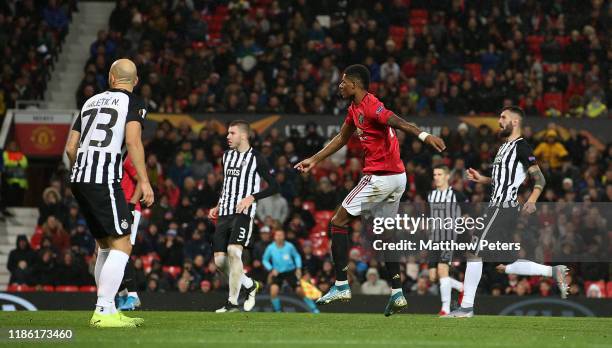 Marcus Rashford of Manchester United scores their third goal during the UEFA Europa League group L match between Manchester United and Partizan at...