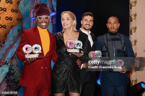 Award winners Billy Porter, Sharon Stone, Mariano Di Vaio and Lewis Hamilton on stage during the GQ Men of the Year Award show at Komische Oper on...