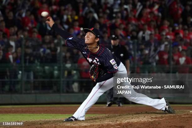 Pitcher Yoshinobu Yamamoto of Japan throws in the bottom of 9th inning during the WBSC Premier 12 Opening Round Group B game between Chinese Taipei...