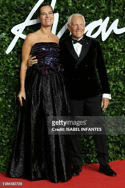 Italian fashion designer Giorgio Armani and Roberta Armani poses on the red carpet upon arrival at The Fashion Awards 2019 in London on December 2,...