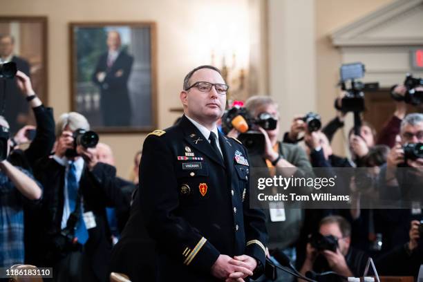 Lt. Col. Alexander Vindman, director of European affairs at the National Security Council, waits for the arrival of Jennifer Williams, an aide to...