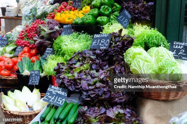 freshness of vegetables in the buckets in the local market in london, uk - borough bildbanksfoton och bilder