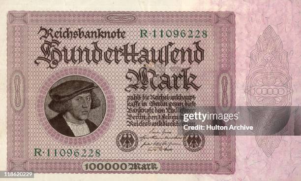 One hundred thousand Mark banknote, an example of hyperinflation in the Weimar Republic, Germany, February 1923. The period of hyperinflation in...
