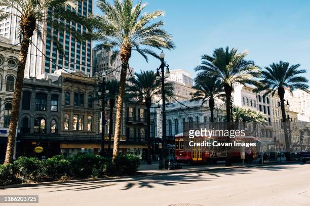 busy street life in downtown new orleans - new orleans stock pictures, royalty-free photos & images