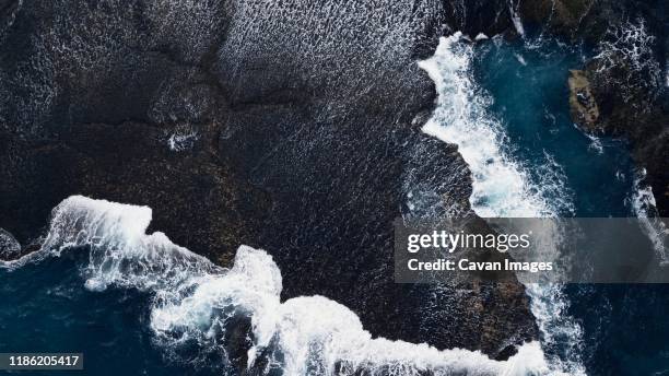 birds eye view of a rock shelf at low tide at back beaches - aerial melbourne fotografías e imágenes de stock