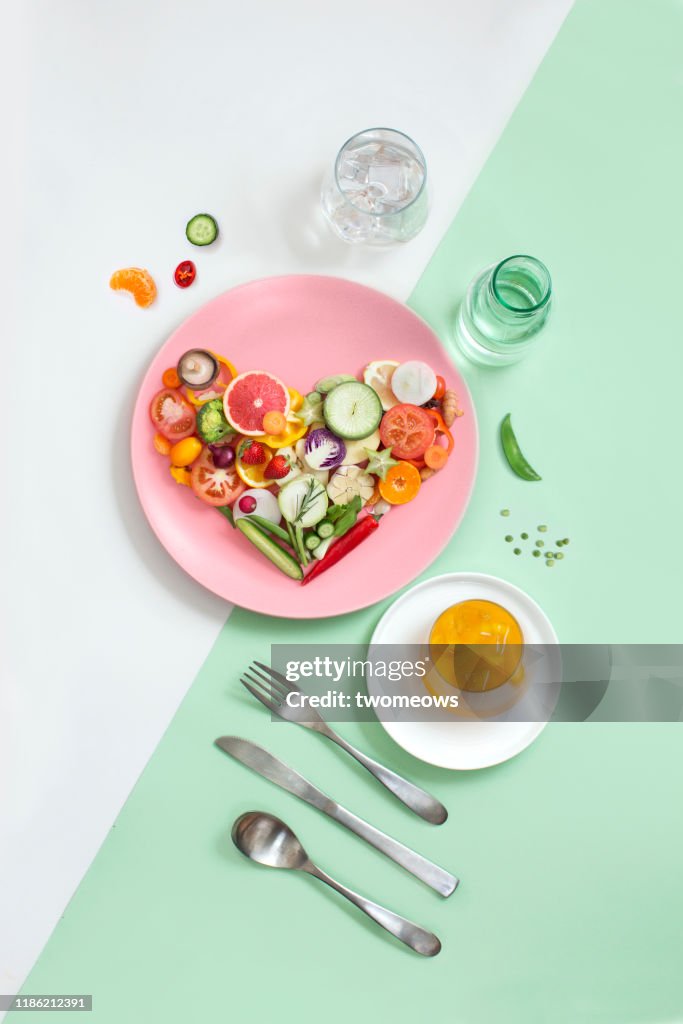 Colourful vegan food eating conceptual still life.