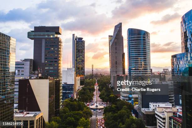 aerial of mexico city cbd and diana the huntress fountain (fuente de la diana cazadora) at sunset - diana center stock pictures, royalty-free photos & images