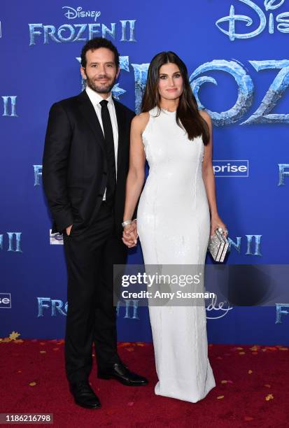 Aaron Lohr and Idina Menzel attend the premiere of Disney's "Frozen 2" at Dolby Theatre on November 07, 2019 in Hollywood, California.