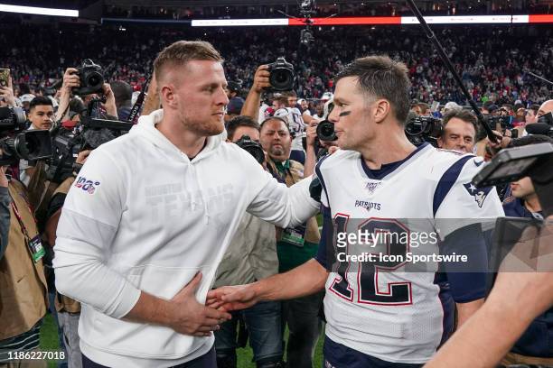 Houston Texans defensive end J.J. Watt and New England Patriots quarterback Tom Brady shake hands after the game between the New England Patriots and...