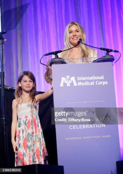 Sienna Miller speaks onstage with daughter, Marlowe Ottoline Layng Sturridge at the International Medical Corps Annual Awards Celebration at The...