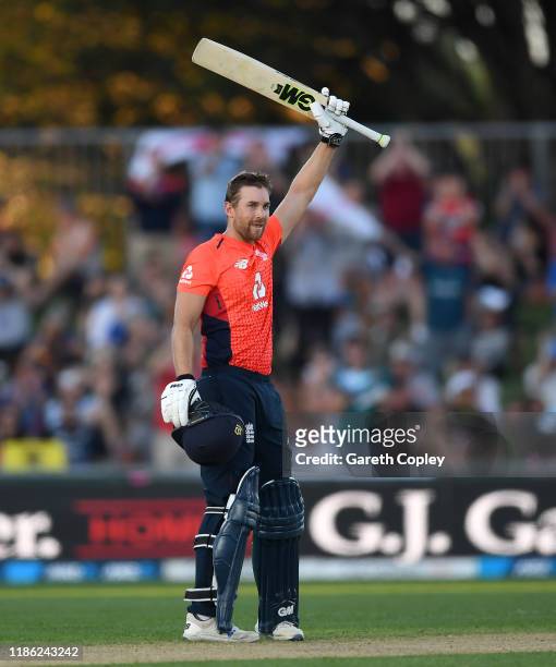 Dawid Malan of England celebrates reaching his century during game four of the Twenty20 International series between New Zealand and England at...