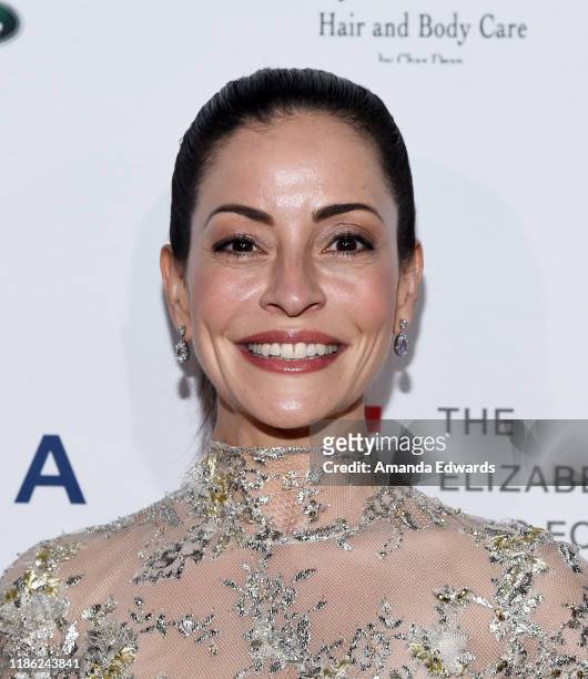 Emmanuelle Vaugier arrives at a cocktail reception benefiting The Elizabeth Taylor AIDS Foundation at the Mark Zunino Atelier on November 07, 2019 in...