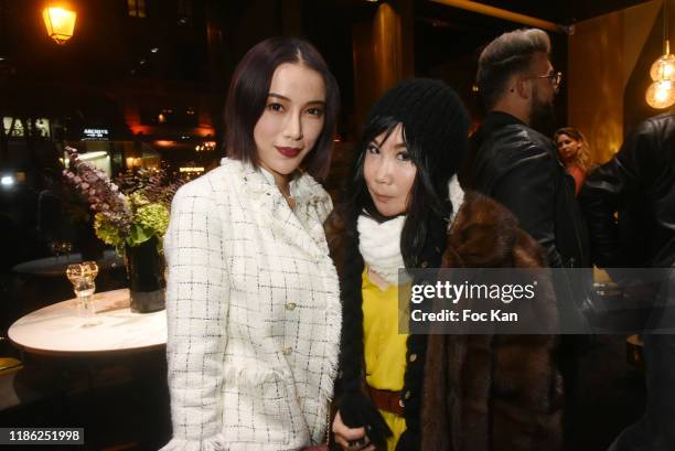 Actress/blogger Asabella Xia and actress Yubai Zhang attend the Red X BHV Marais Ephemere Boutique Launch Party on November 07, 2019 in Paris, France.