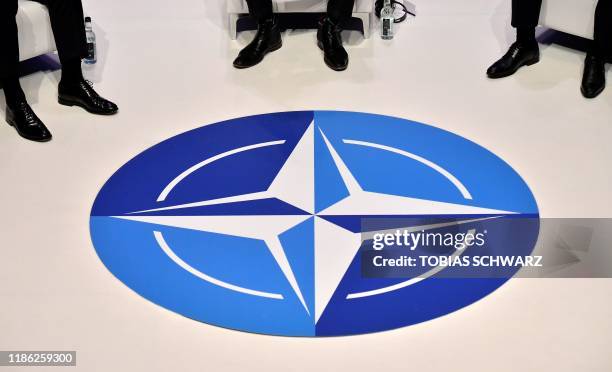 The Nato logo is pictured during a panel discussion at an official NATO outreach event, 'Nato Engages' in central London on December 3 prior to the...