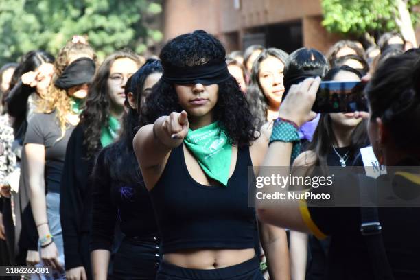 During the visit of former Uruguayan President Jose Mujica, a group of Feminist students protest against femicide and violence against women in...