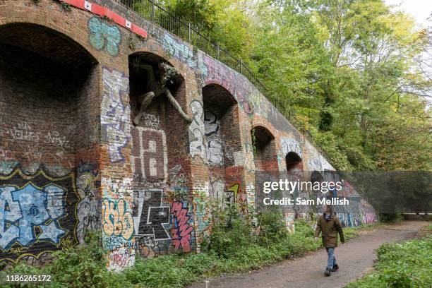 Parkland walk and Marilyn Collins Spriggan sculpture on the 15th October 2019 in London in the United Kingdom. Parkland Walk follows the course of...