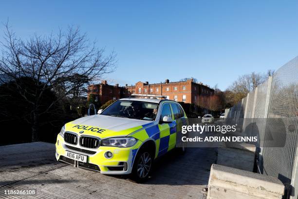 Police officers patrol in the grounds of The Grove Hotel in Watford, south east England on December 3 prior to the NATO alliance summit. NATO leaders...