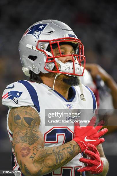 New England Patriots strong safety Patrick Chung warms up before the football game between the New England Patriots and Houston Texans at NRG Stadium...