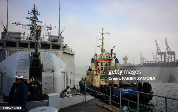 In this photograph taken on November 30 sailors prepare for the docking of France's Marine Nationale ship Commandant Birot at the port of Odessa in...