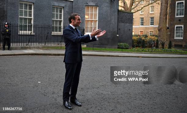 France's President Emmanuel Macron reacts as he arrives at 10 Downing Street on December 3, 2019 in London, England. France and the UK signed the...