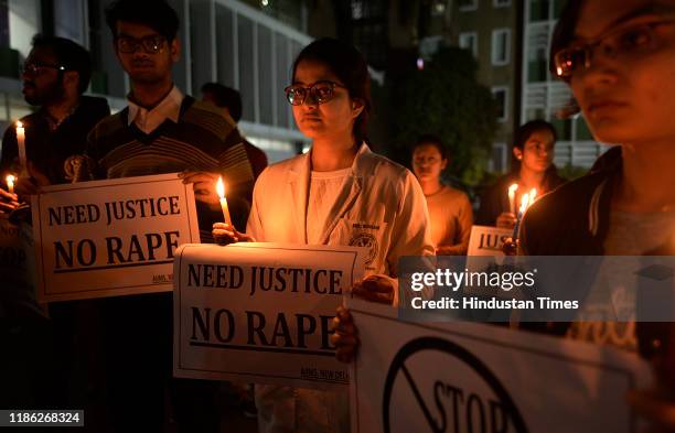 Resident doctors and medical students from All India Institute of Medical Sciences seen during candle-lit march to protest against the rape and...