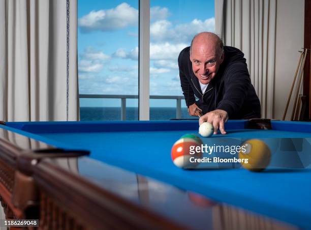 Steven Schonfeld, chief executive officer and founder of Schonfeld Group Holdings LLC, plays pool in an arranged photograph taken in Palm Beach,...