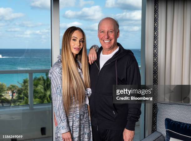 Steven Schonfeld, chief executive officer and founder of Schonfeld Group Holdings LLC, and his wife Brooke Schonfeld stand for a photograph in Palm...