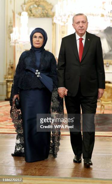 Turkish President Recep Tayyip Erdogan arrives with his wife Emine at a reception for NATO leaders hosted by Queen Elizabeth II at Buckingham Palace...