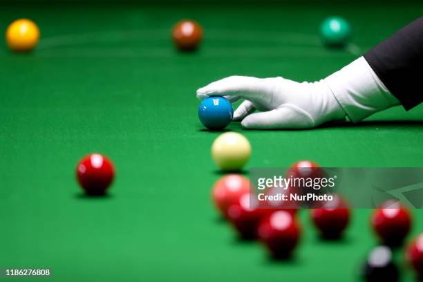 Game official inspects the placement of the ball in the Snooker Double competition for the 30th SEA Games held in Manila on December 3, 2019.