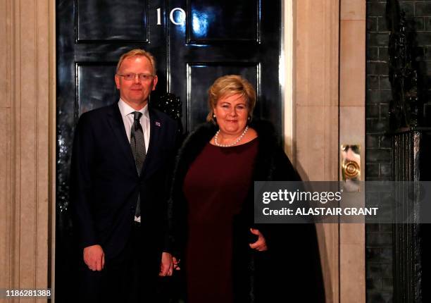 Norway's Prime Minister Erna Solberg and her husband Sindre Finnes arrive at 10 Downing Street in central London on December 3 to attend reception...