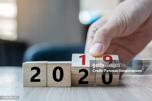 close-up of hand holding toy blocks on table - 2019 2020 stock pictures, royalty-free photos & images