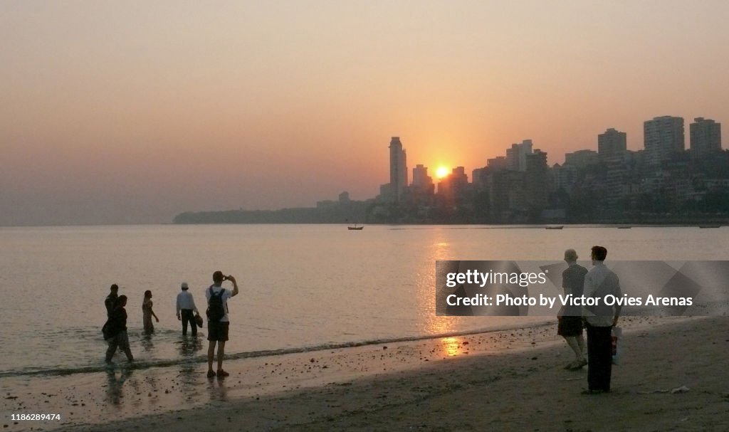 Sunset over Malabar hill from Chowpatty beach in Mumbai, Maharashtra, India